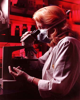 photo of a researcher at a microscope